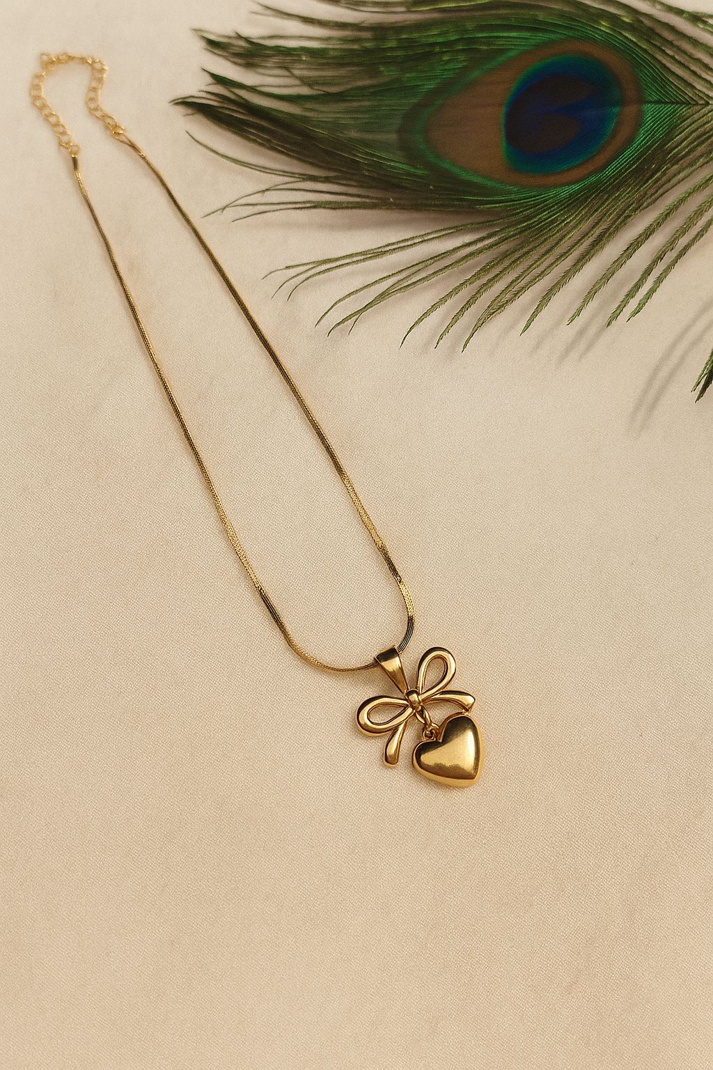 Elite Oasis “Golden Amora Bow” Necklace